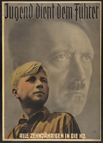 'Youth serves the leader - all ten year-olds into the Hitler Youth'. Poster shows German boy wearing Hitler Youth uniform, with portrait of Adolf Hitler behind him. 1941.